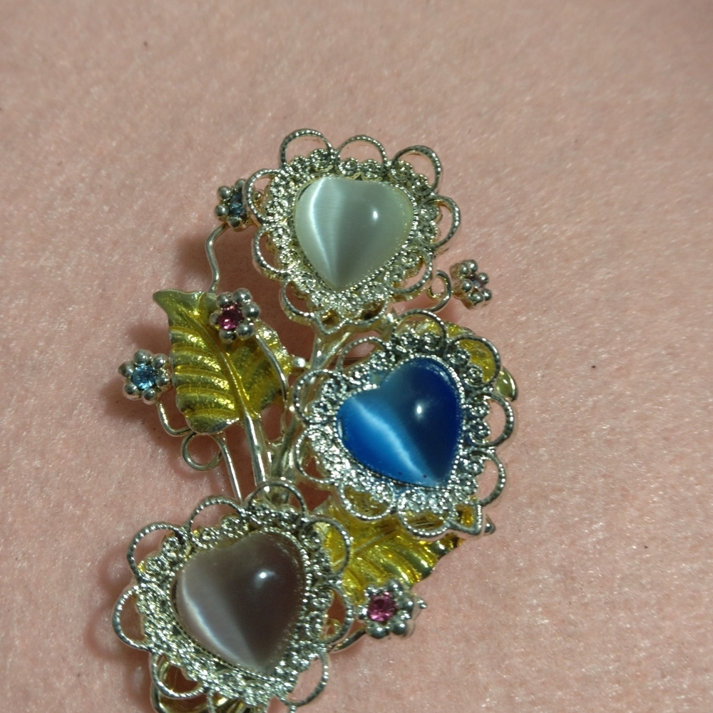 Elegant Silver Heart Brooch with Blue and Yellow Accents